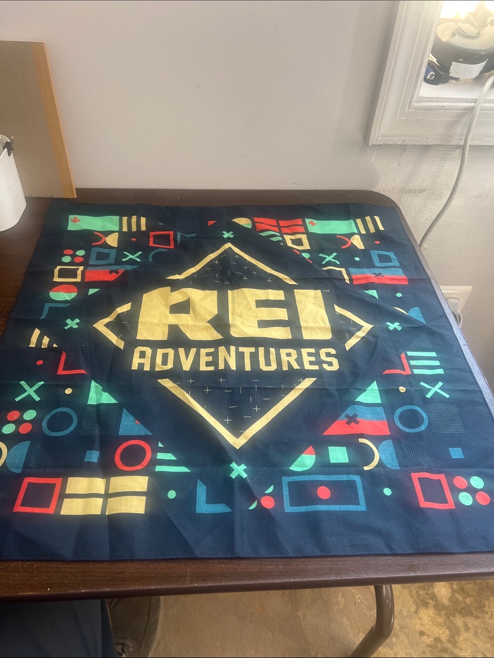 REI Navy Bandana with Yellow Logo and Multicolor Geometric Print
